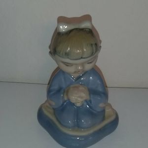 Chinese praying doll